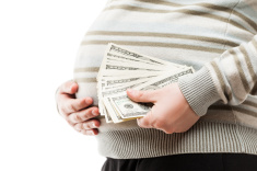 stock-photo-25419715-pregnant-woman-holding-dollar-currency-cash